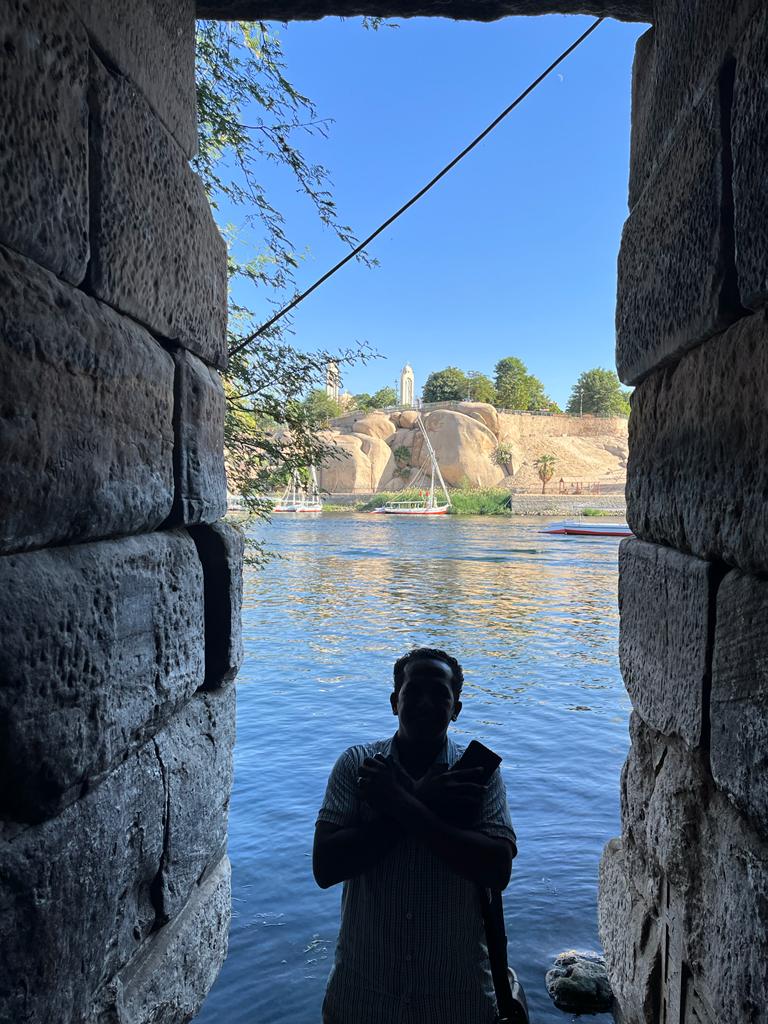 Artistic Nile View Through Ancient Columns